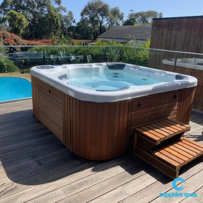 Spa pool overlooking swimming pool thanks to the team @Prestige Spas Cheltenham