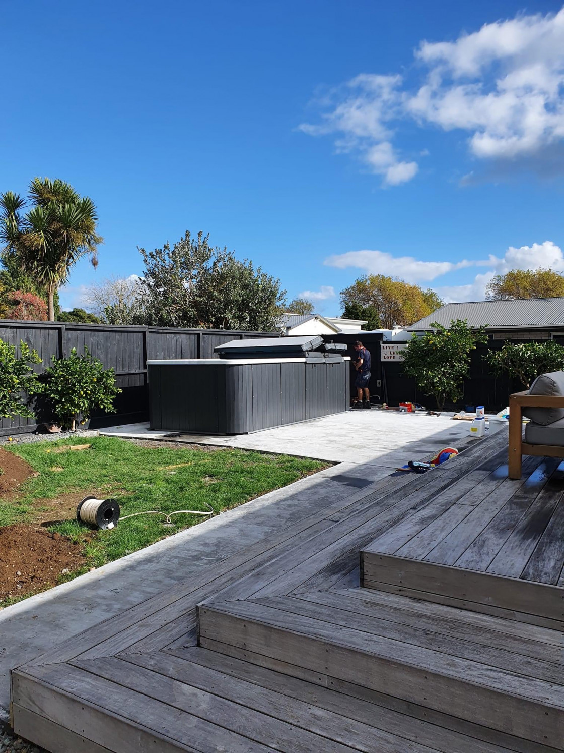 Swim spa installed in backyard on concrete slab