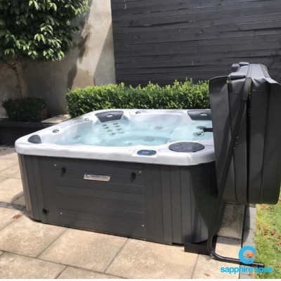 Thanks to the team @ Spa Pools Otago : cosmic swirl spa & grey duratek cabinet works well with black stained timber backdrop & overhanging greenery